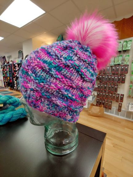 Multicolor hat in pink, purple and aqua with a hot pink pompom